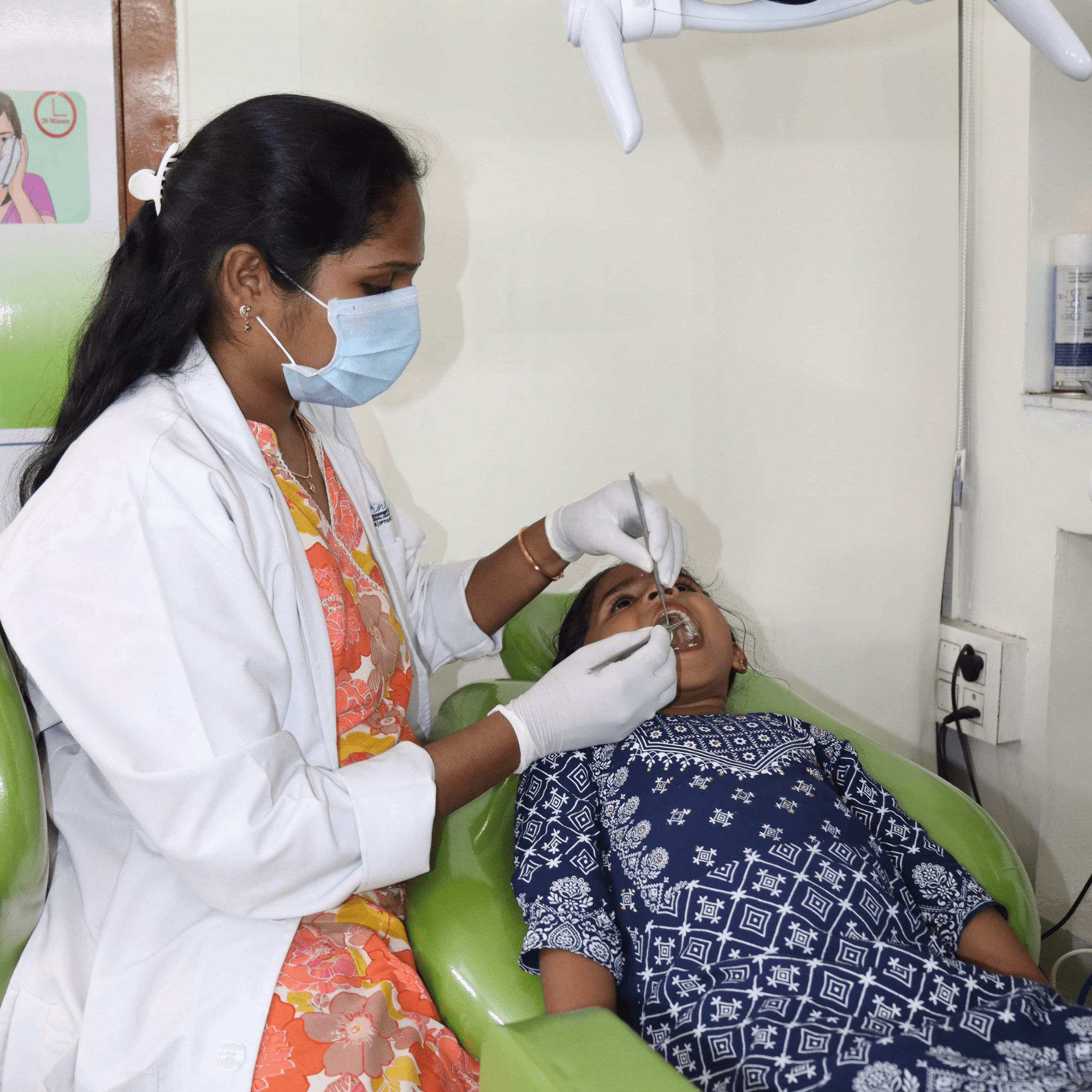 cornealdent dentist treating a small girl-min