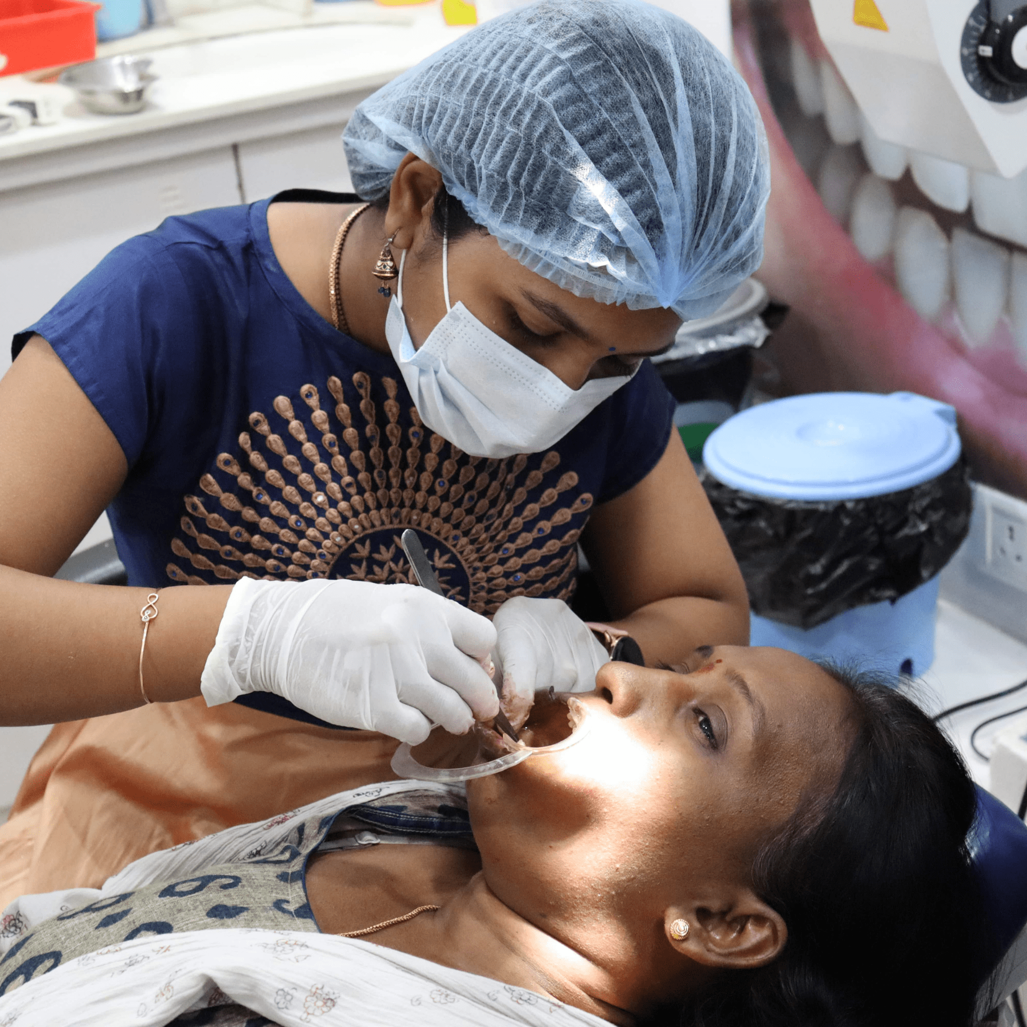 cornealdent dentist treating a women patient-min