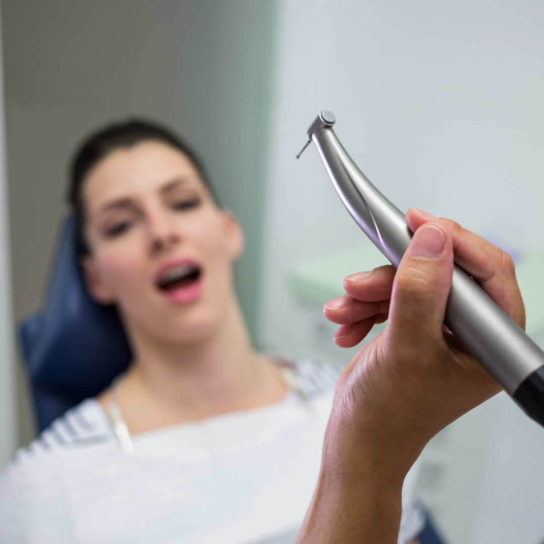 dentist using Dental lasers to treat female petient